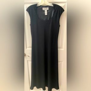 Solid black semi formal dress. Great condition with no damage or stains.